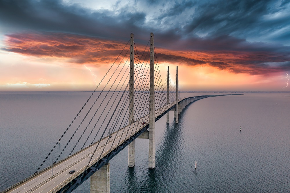 Юлия/замена/mesmerizing-aerial-view-bridge-denmark-sweden-cloudy-sky.jpg